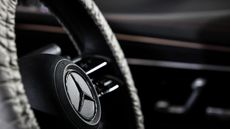 The steering wheel of a Mercedes-Benz vehicle